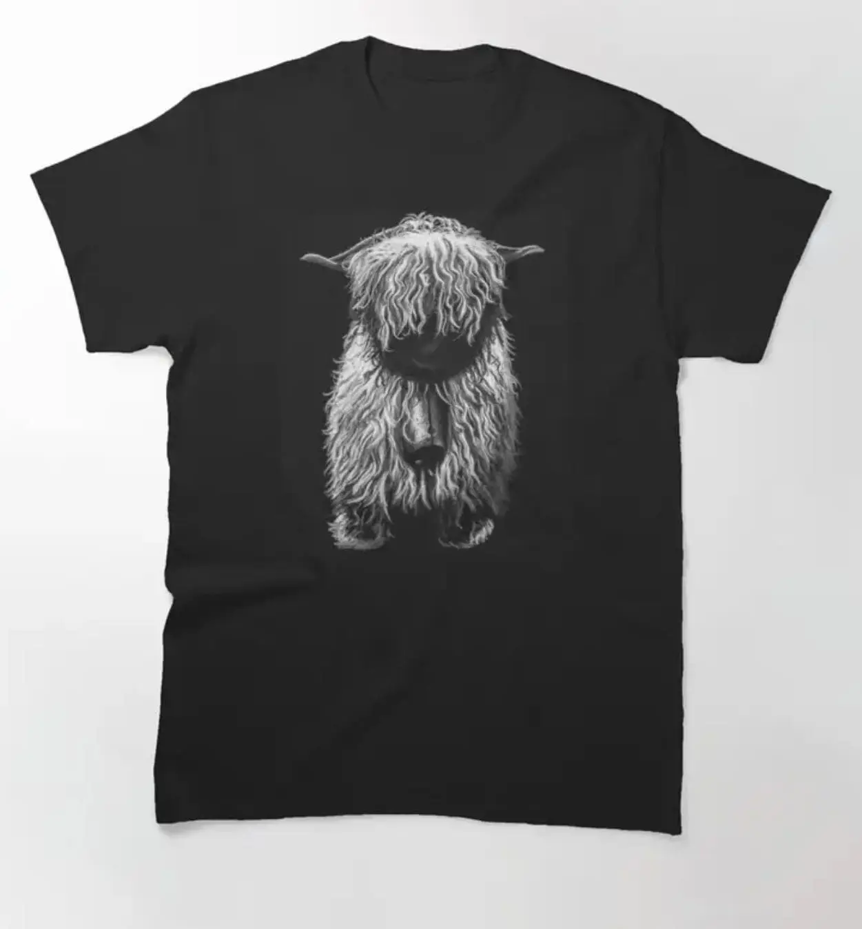 Black t-shirt featuring a detailed highland cow illustration.