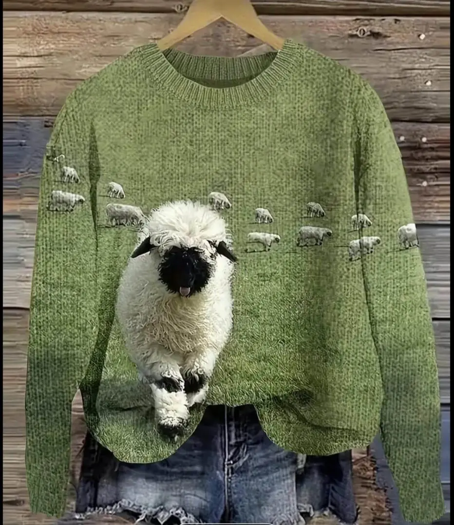 Green sweater with a 3D sheep design and small sheep motifs.