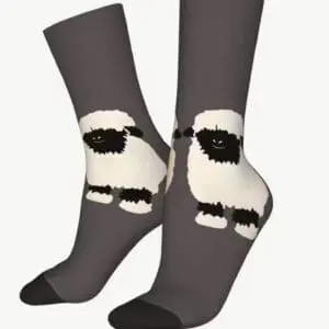 Gray socks with a black and white sheep design on them.