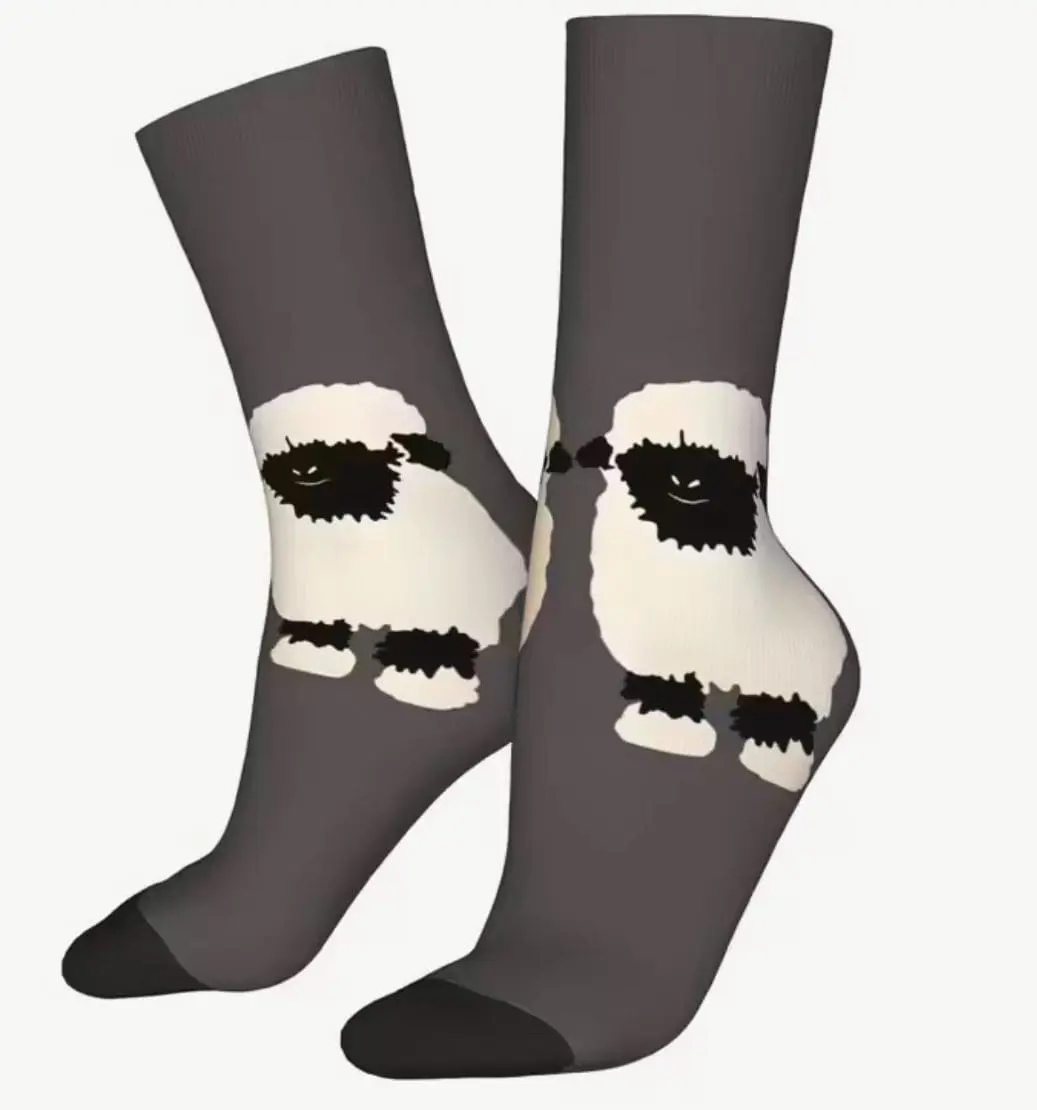 Gray socks with a black and white sheep design on them.